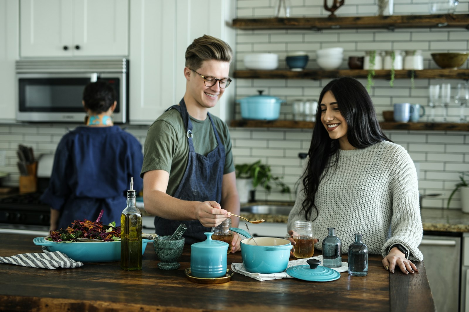 A neat kitchen workspace with cookware prepared for a meal